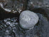 Stone with Word Smile in Water of Tranquil Stream