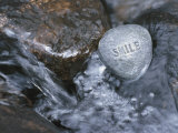 Stone with Word Smile in Water of Tranquil Stream