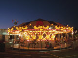 Lights Illuminating Carnival Ferris Wheel at Night