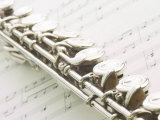 Silver Flute on Sheet of Music