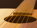 Close-Up Detail of Strings on Wooden Guitar