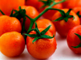 Display of Delicious and Beautiful Red Cherry Tomatoes on Vine