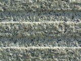 Close-Up of Parallel Horizontal Lines Carved in White Stone
