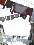 Laundry Hanging from Clotheslines Between Apartment Buildings