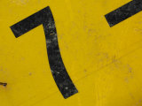 Number Seven on Worn Metal Sign
