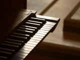 Selective Focus of Piano Keys with Stairs in the Background