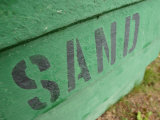 Sand Painted on Bright Green Wood Plank Wall