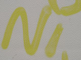 Yellow Graffiti Painted White Wall