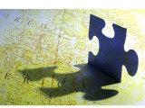 Puzzle Piece and Shadow Superimposed on Map