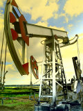 Tinted View of Oil Wells Against the Blue Sky