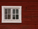 Vibrant Red Painted Barn Wall with White Window