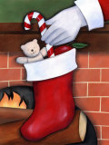 Hand of Santa Claus Placing Candy Cane in Stocking
