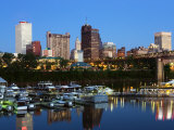 Boats Afloat the Mississippi River in Front of the Memphis Skyline at Dusk