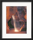 Sunbeam Illuminates Sandy Floor and Sandstone Walls of a Slot Canyon  Antelope Canyon  Page