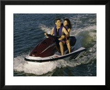 Mid Adult Couple Riding a Jet Ski