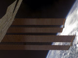 International Space Station's Solar Array Panels and Earth's Horizon