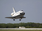 Space Shuttle Discovery Approaches Landing on the Runway at the Kennedy Space Center