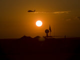 UH-60 Blackhawk Flies over Camp Speicher Airfield at Sunset