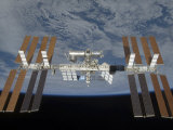 International Space Station  Backdropped by the Blackness of Space and Earth's Horizon