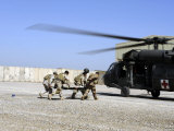 Soldiers Rush a Simulated Casualty to a UH-60 Blackhawk Helicopter