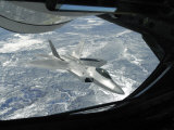 F-22 Raptor Banks Away from a KC-135 Statotanker During a Refueling Operation