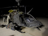 Maintenance Crew Works on Servicing the OH-58 Kiowa before its Next Mission