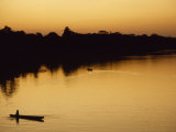 People in Canoes on the Calm Waters of the Amazon River  Amazon River  Colombia and Peru