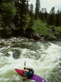 Kayaker Paddles to Get Through the Rapids  Middle Fork Of The Salmon River  Idaho