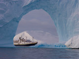 National Geographic Endeavour Framed in a Beautiful Iceberg Arch  Antarctic Peninsula  Antarctica