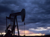 Oil Rig Silhouetted at Sunset  Adobe Town  Wyoming