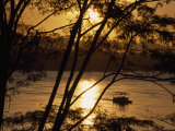 Water Taxi Ferries Passengers across River at Sunrise  Rio Madre de Dios  Puerto Maldonado  Peru