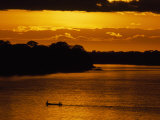 Water Taxi Ferries People across the Madre De Dios River at Sunrise