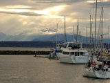 Scene of Boats in a Seattle Marina and the Olympic Mountain Range in the Distance