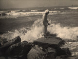 Fisherman Working on the Rocks