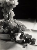Bunch of Grapes Hanging Out of the Fruit Bowl