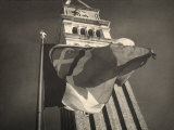 Flag Blowing in the Wind at the Foot of the Bell Tower of St Mark's in Venice