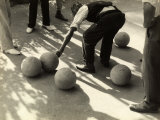 Player Measuring the Distance Between Two Bocce Balls