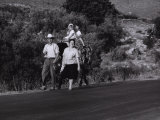 Couple with Kids on a Horse