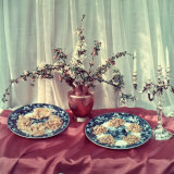 Table Covered with Red Satin  a Silver Candelabra  a Copper Pitcher and Two Colorful Plates