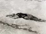 View from Above of a Swimmer in a Pool Doing the Backstroke