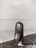 Trombone Resting on the Rocks at the Edge of the Sea