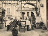 Woman Looking Out onto the Terrace of a Restaurant