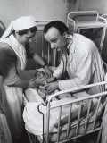 Doctor and a Nurse Visiting a Newborn in a Hospital During World War II