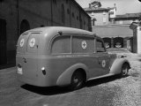 Red Cross Ambulance Parked on a Street in Bologna