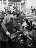 Worker Working at Various Machines in the Innocenti Automobile Factory