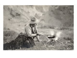 Cowboy Cooking over Campfire
