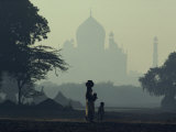 Taj Mahal with Woman and Child Silhouetted in Foreground at Dusk  Agra  Uttar Pradesh  India