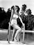 Rita Hayworth Relaxes at Home Via a Dip in the Pool  1946