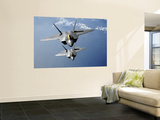 Two F-22 Raptors Fly over the Pacific Ocean