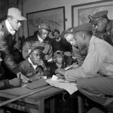 Preflight Briefing of Several Tuskegee Airmen at Ramitelli  Italy  March 1945